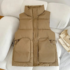 Tan puffy winter vest with front pockets and buckle details, Carino düşük yaka tasarımı